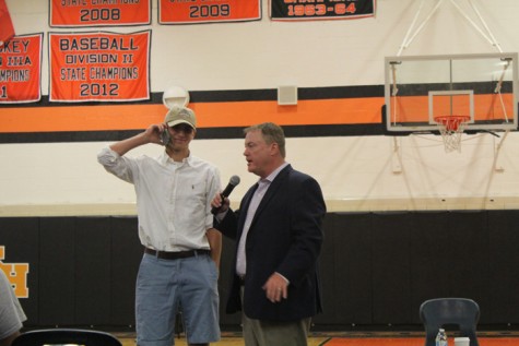 Colin Paleologopoulos gets pulled from the crowd during the speech.