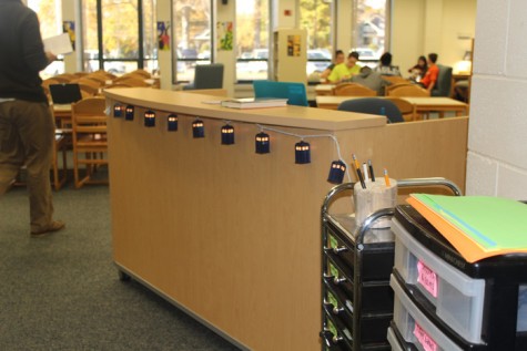 Miniature electric lanterns adorn librarian Rebecca Mazur’s new desk, providing a warm ambiance.